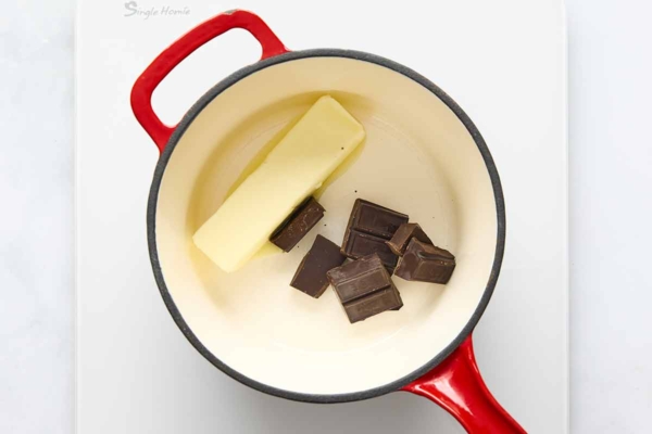 Butter and chocolate melting in a saucepan.