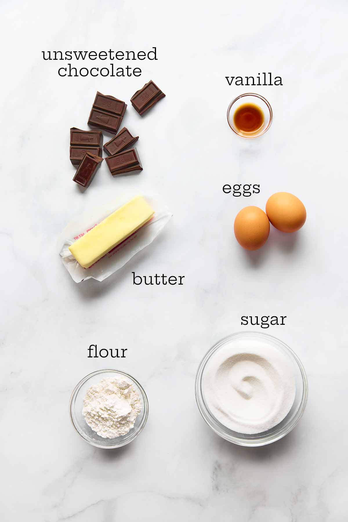 Ingredients for Katharine Hepburn brownies--chocolate, vanilla, butter, eggs, flour, and sugar.