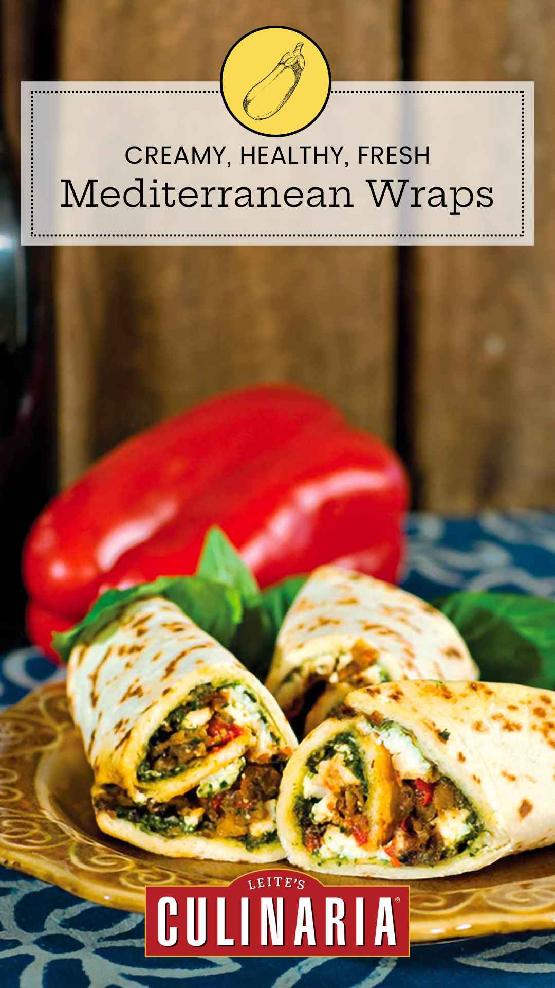 Three Mediterranean eggplant wraps on a plate with a whole red pepper in the background.