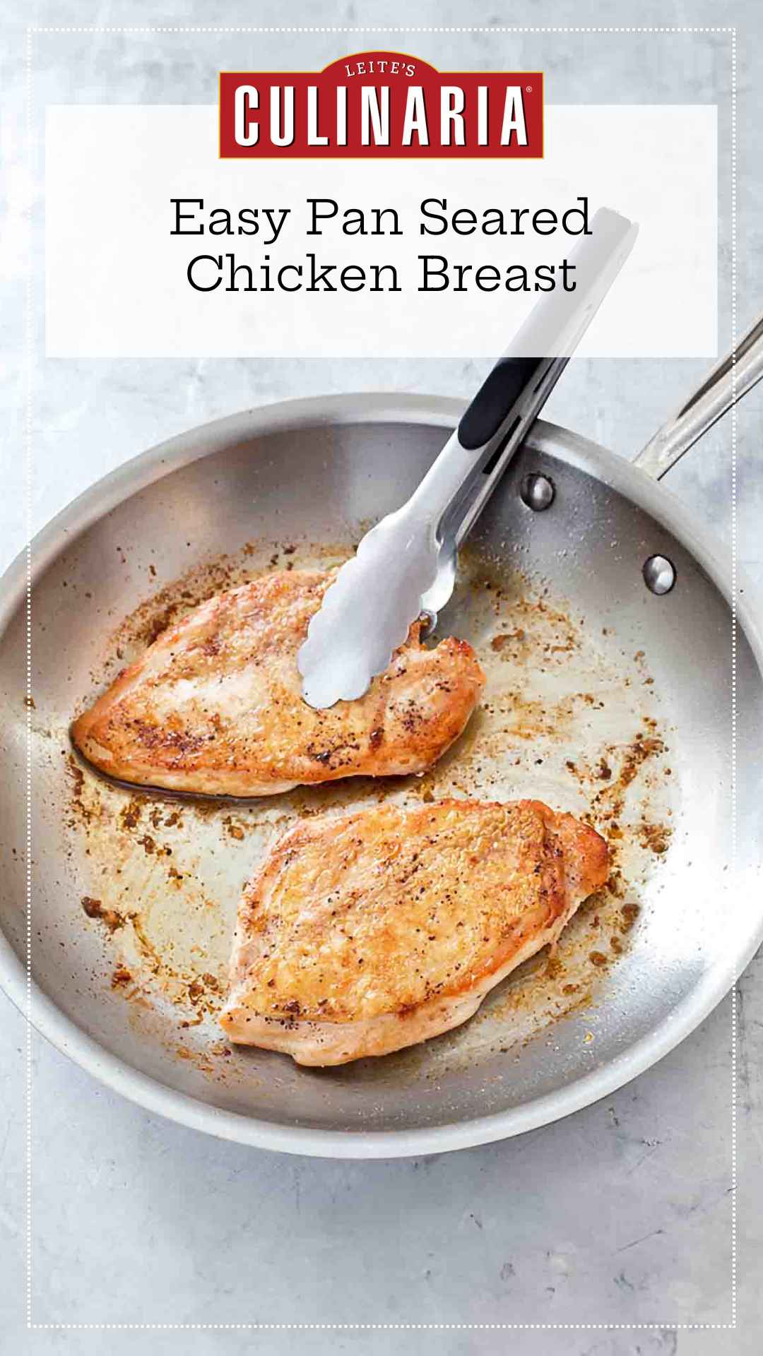 Two crispy pan seared chicken breasts in a metal skillet with a set of tongs.