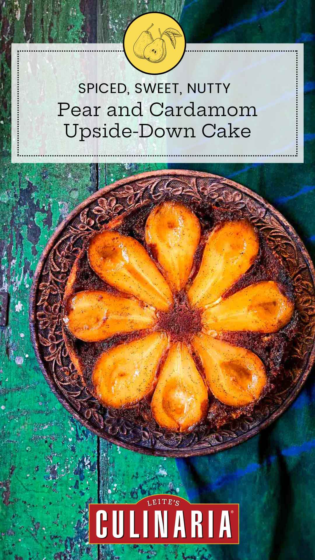 A pear upside-down cake with eight visible pear halves on a decorative plate.