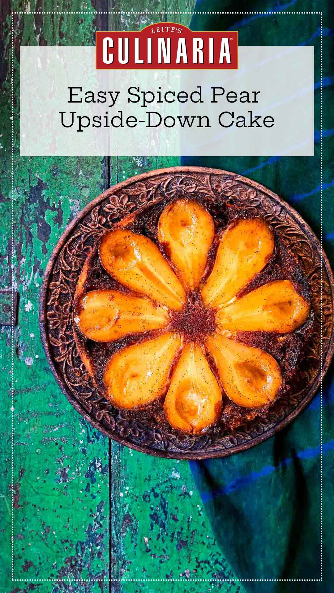 A pear upside-down cake with eight visible pear halves on a decorative plate.