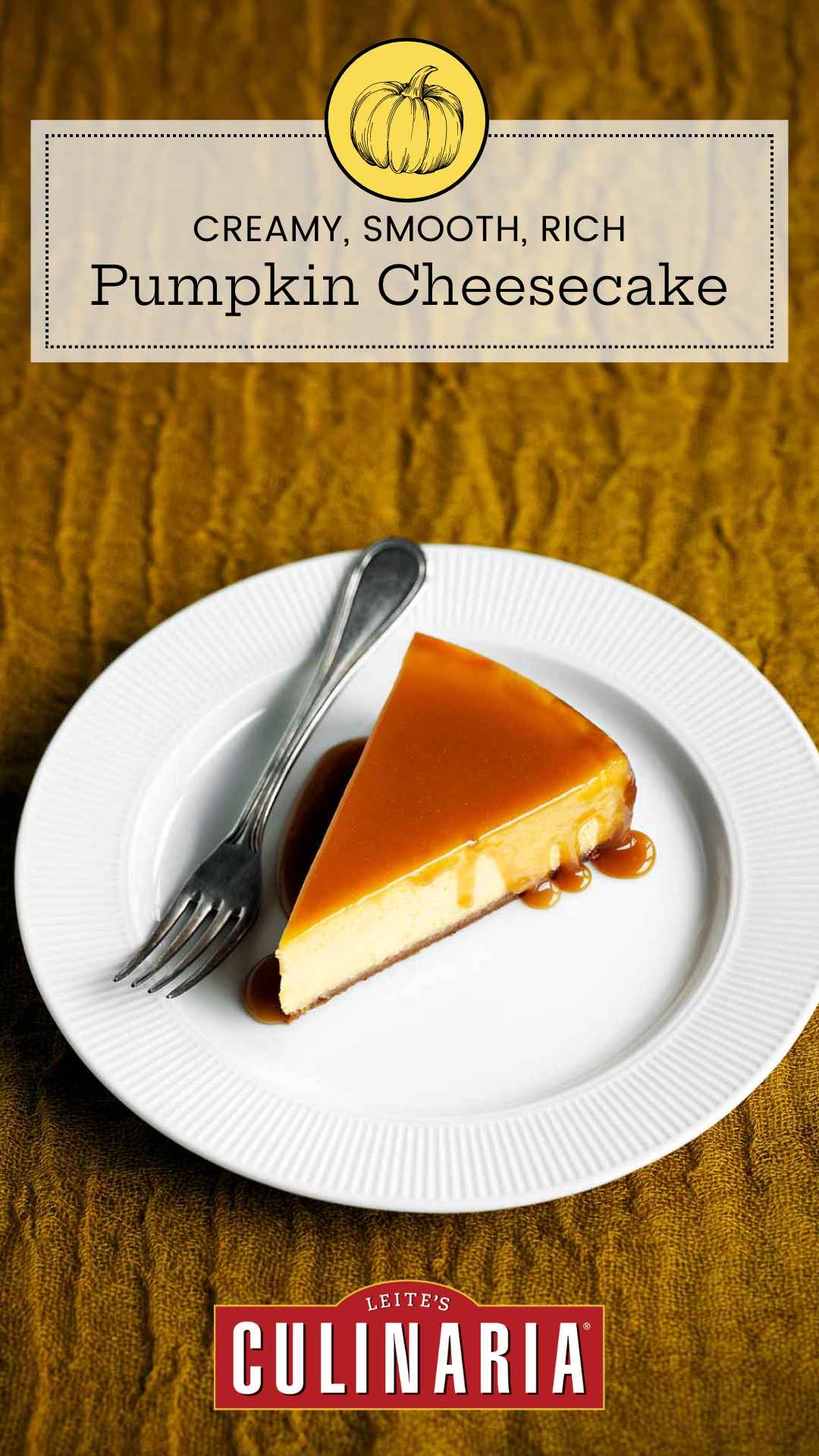 A slice of pumpkin cheesecake with caramel glaze drizzled over the top on a white plate with a fork on the side.