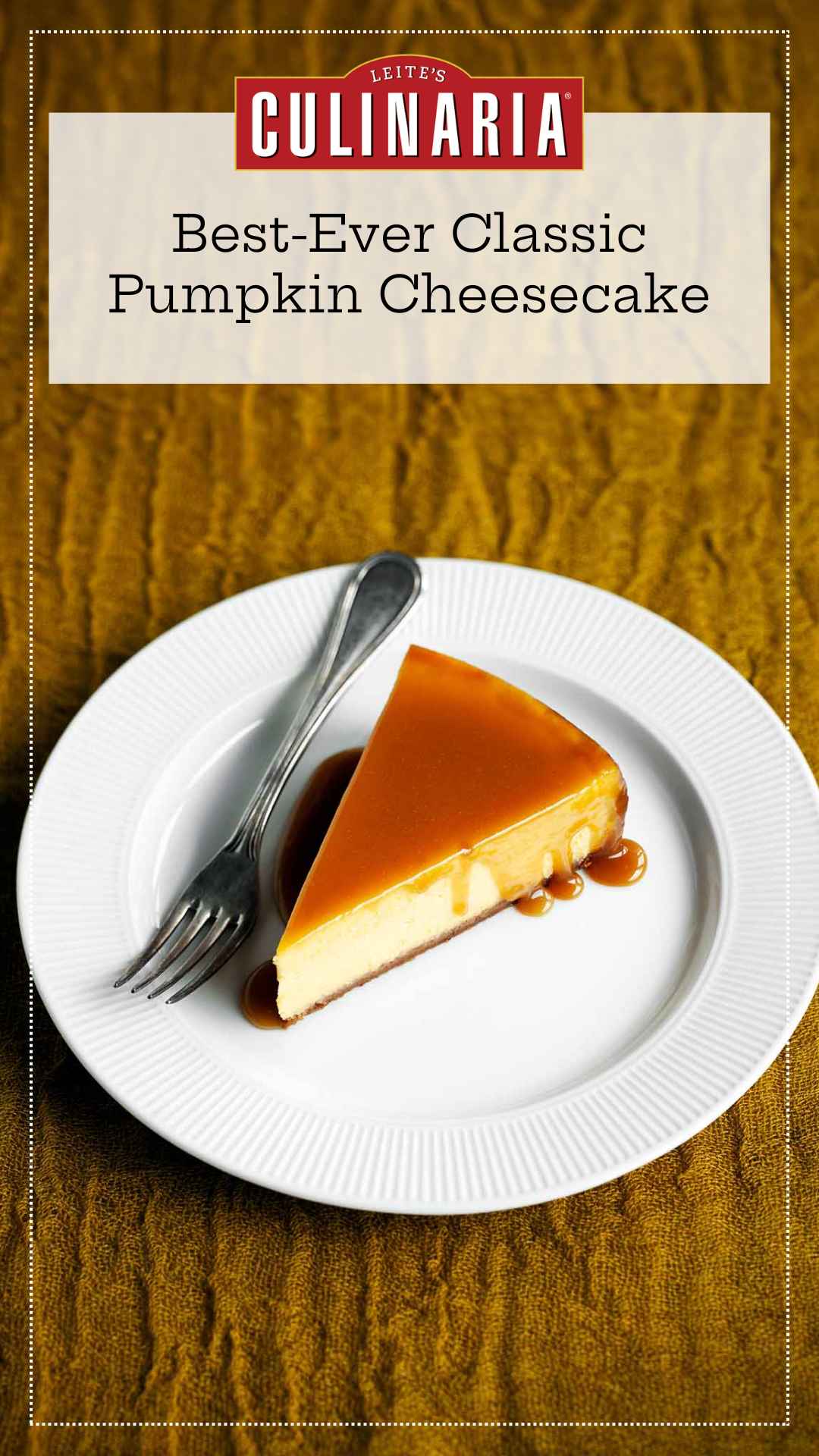 A slice of pumpkin cheesecake with caramel glaze drizzled over the top on a white plate with a fork on the side.