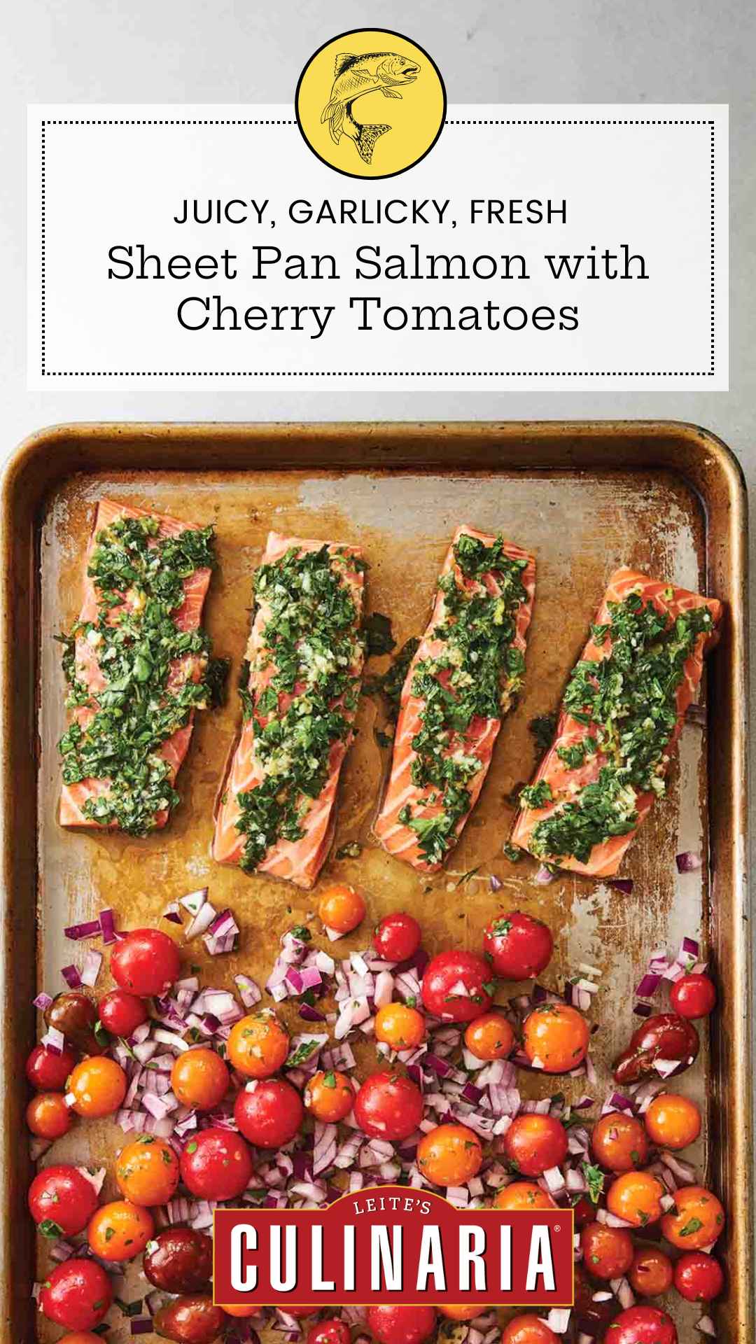 A baking sheet with four filets of salmon topped with a herb mixture, and a mixture of cherry tomatoes and red onion on the rest of the sheet.