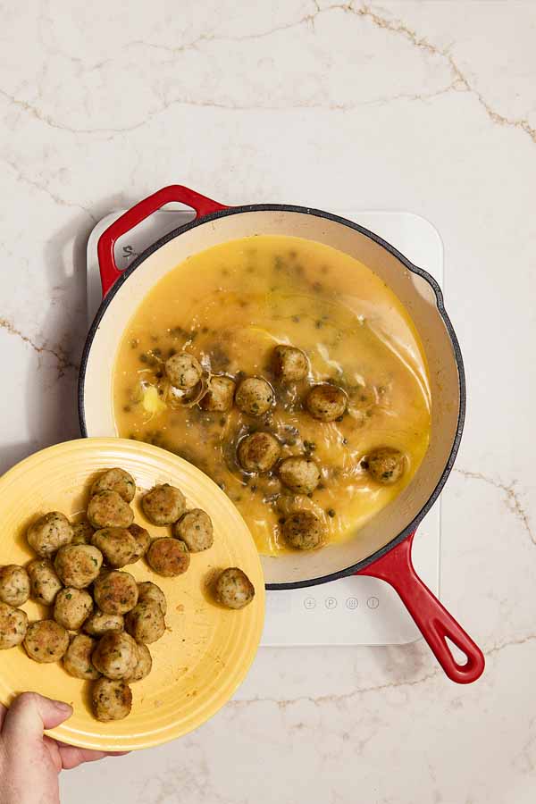 Chicken meatballs added back to pan to simmer in piccata sauce.
