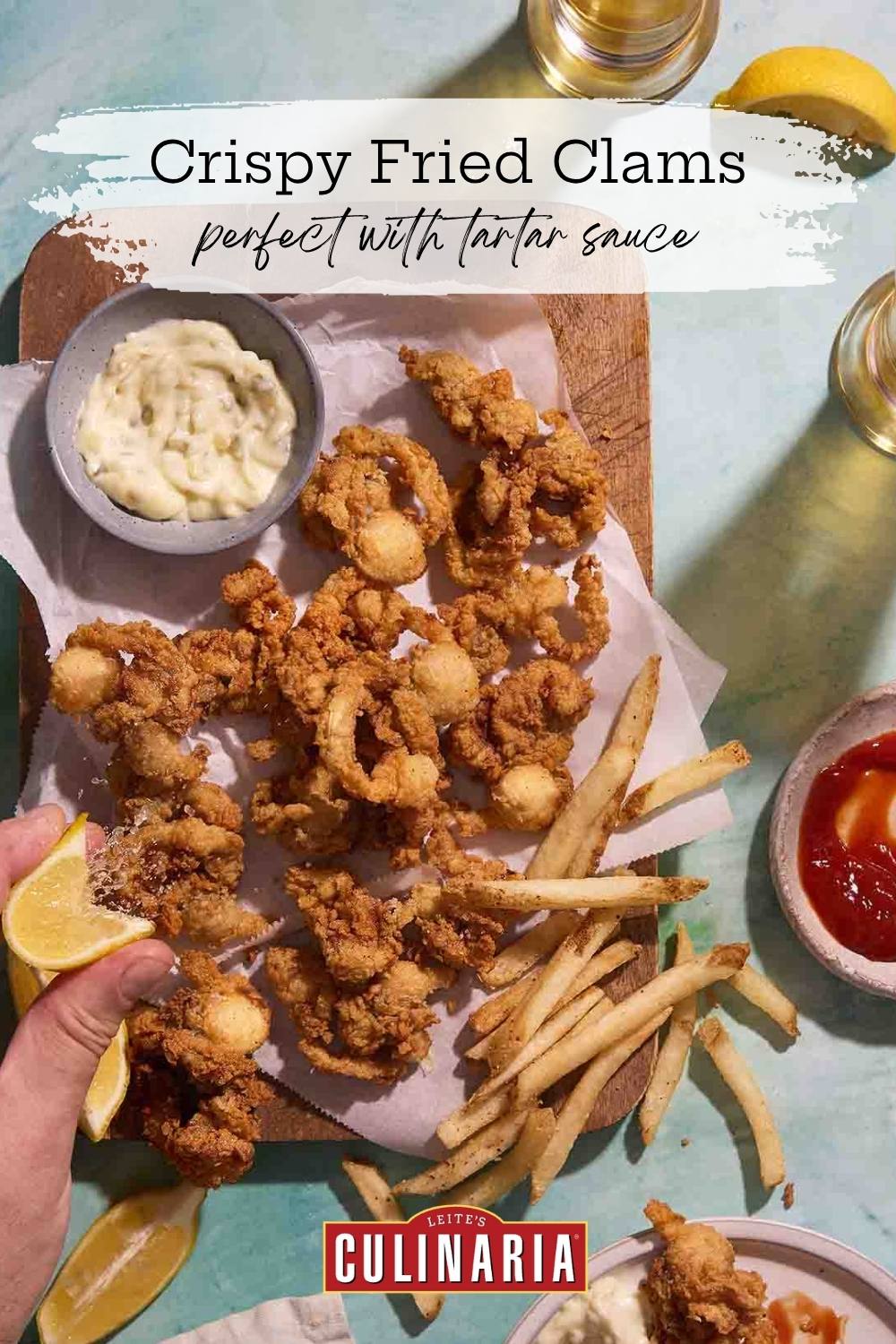 A Pinterest pin showing golden fried clams, fries, and tartar sauce, with text "Crispy Fried Clams, perfect with tartar sauce" and Leite's Culinaria branding.
