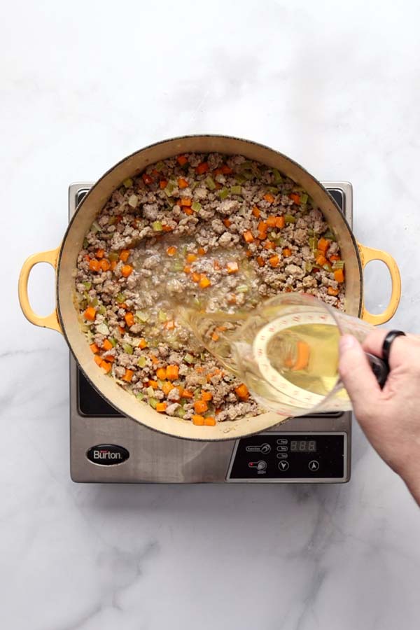 White wine and freshly grated nutmeg stirred into the Bolognese sauce after the milk has evaporated.