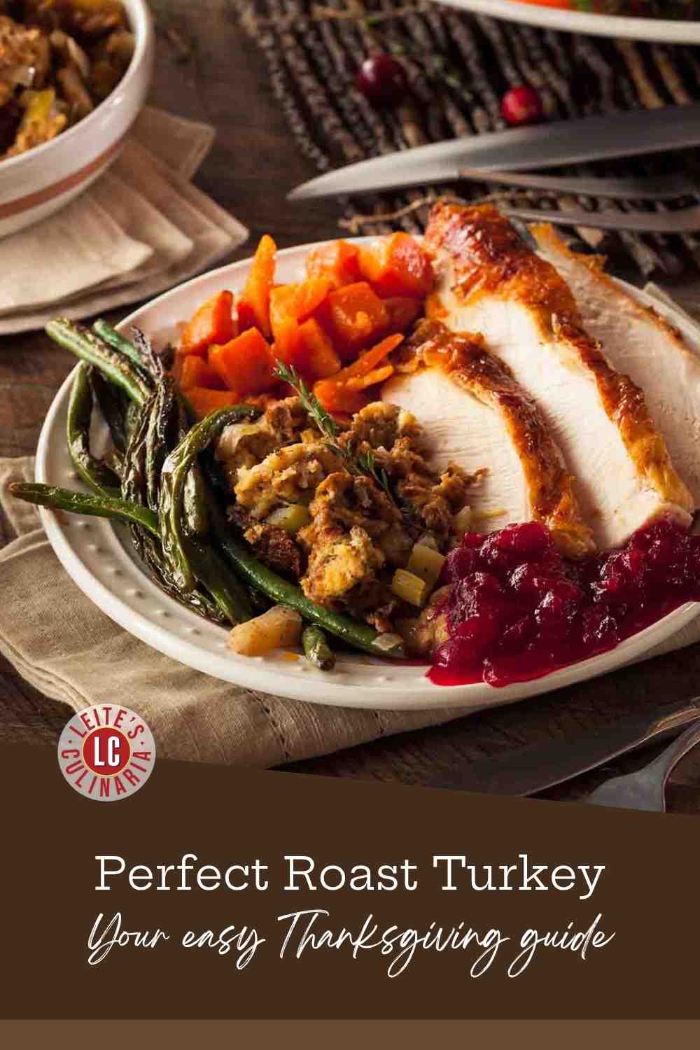 A plate of classic roasted turkey surrounded by chunks of roasted carrots and parsnips, with a scoop of herbed stuffing.