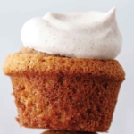A cupcake with a swirl of spicy chai whipped cream on top