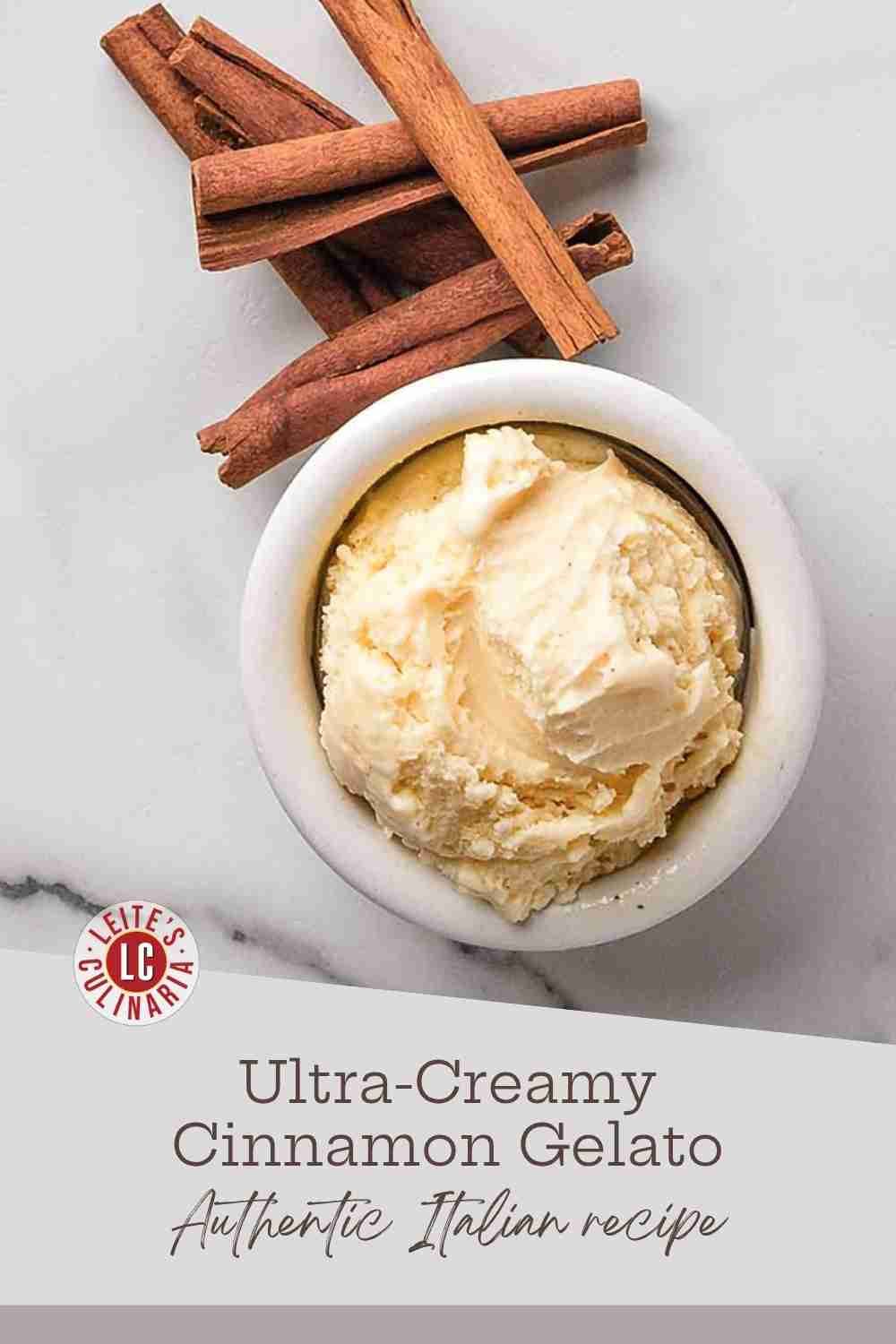 A creamy, pale yellow scoop of cinnamon gelato in a white bowl next to several dried cinnamon sticks on a white marble counter.