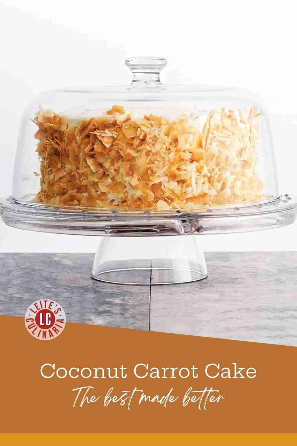 Side view of a round layer cake covered in cream cheese frosting and a thick coating of toasted coconut flakes.