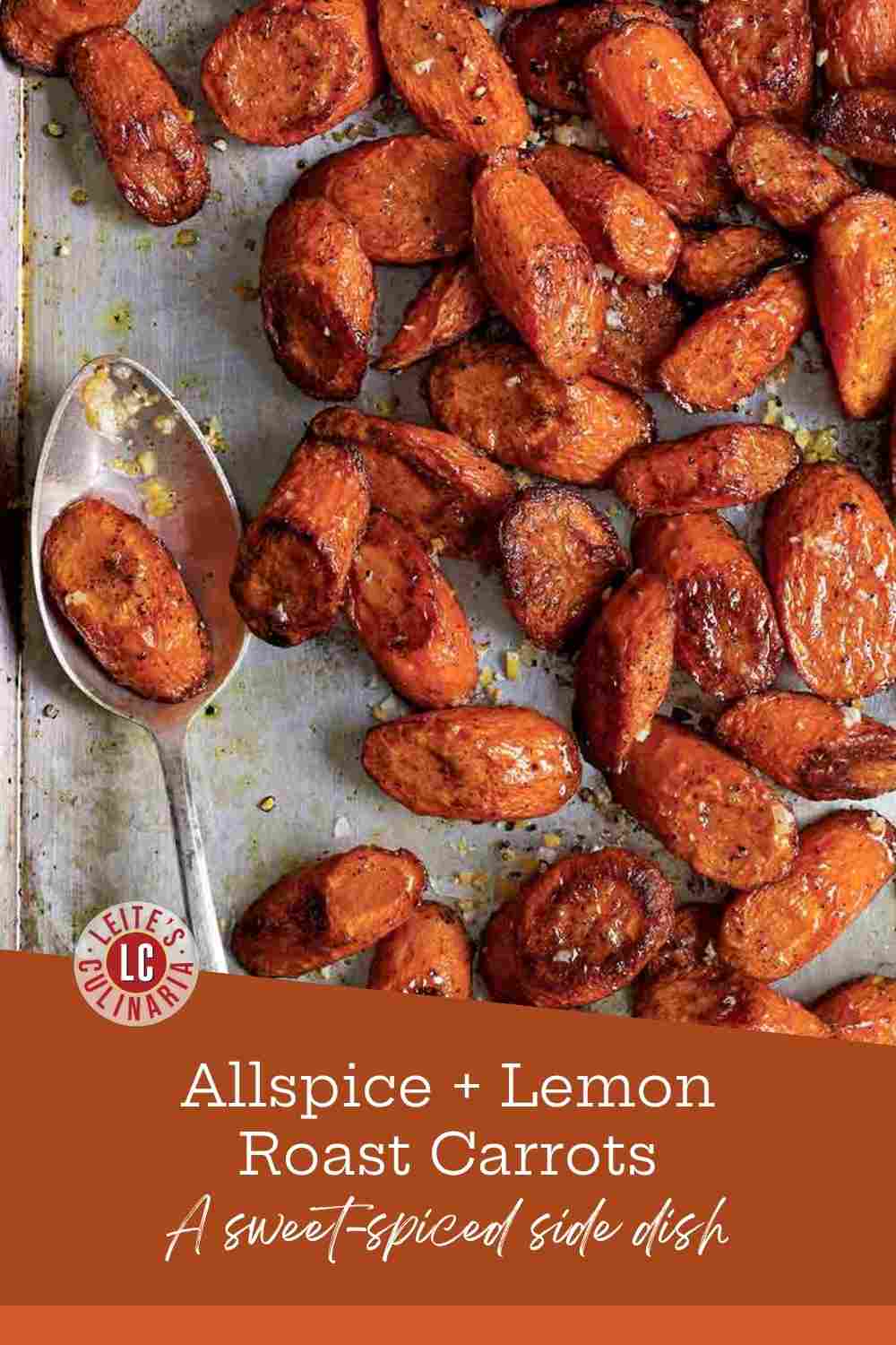 Roasted carrots with allspice, preserved lemon pieces, and fresh garlic, served warm on a rimmed baking sheet.