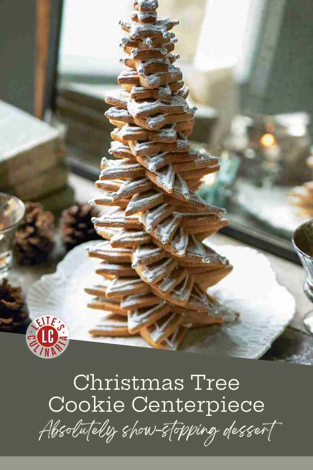 Stacked star-shaped gingerbread or sugar cookies forming a Christmas tree, frosted with royal icing.