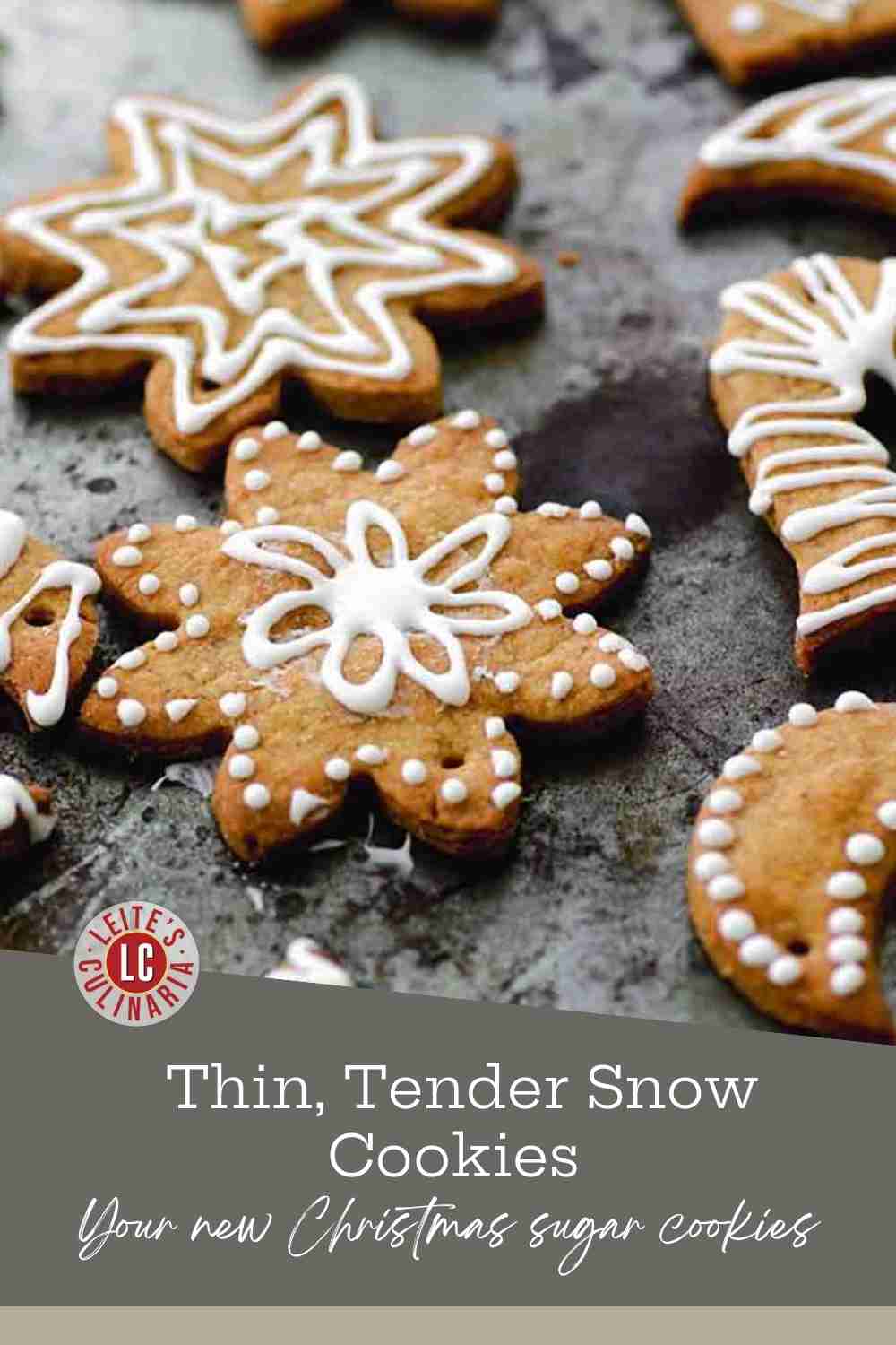 Assortment of star, snowflake, heart, and candy cane sugar cookies with white lemon icing drizzle.