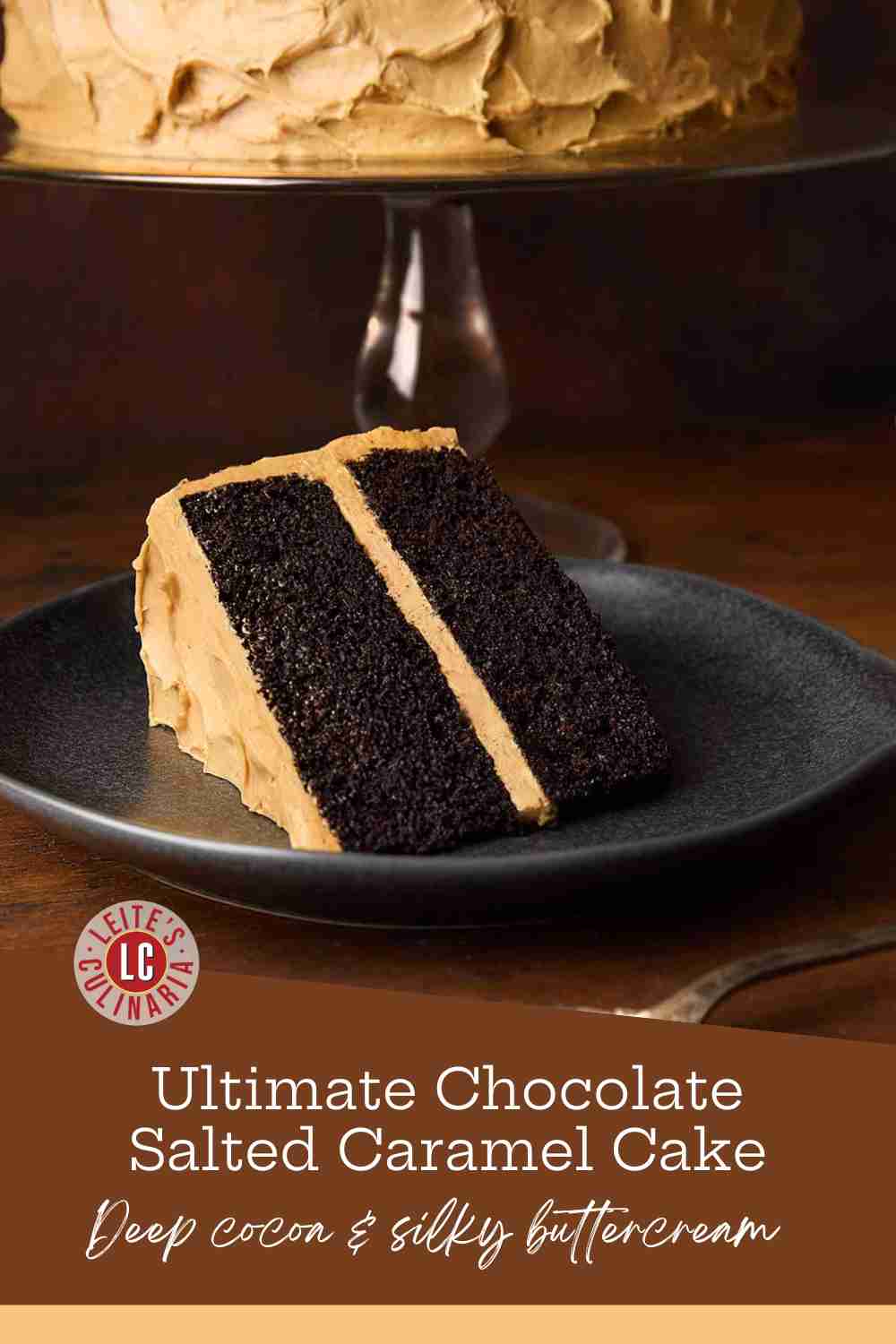 A slice of two-layer dark chocolate cake, with thick swirls of golden caramel frosting on a plate.