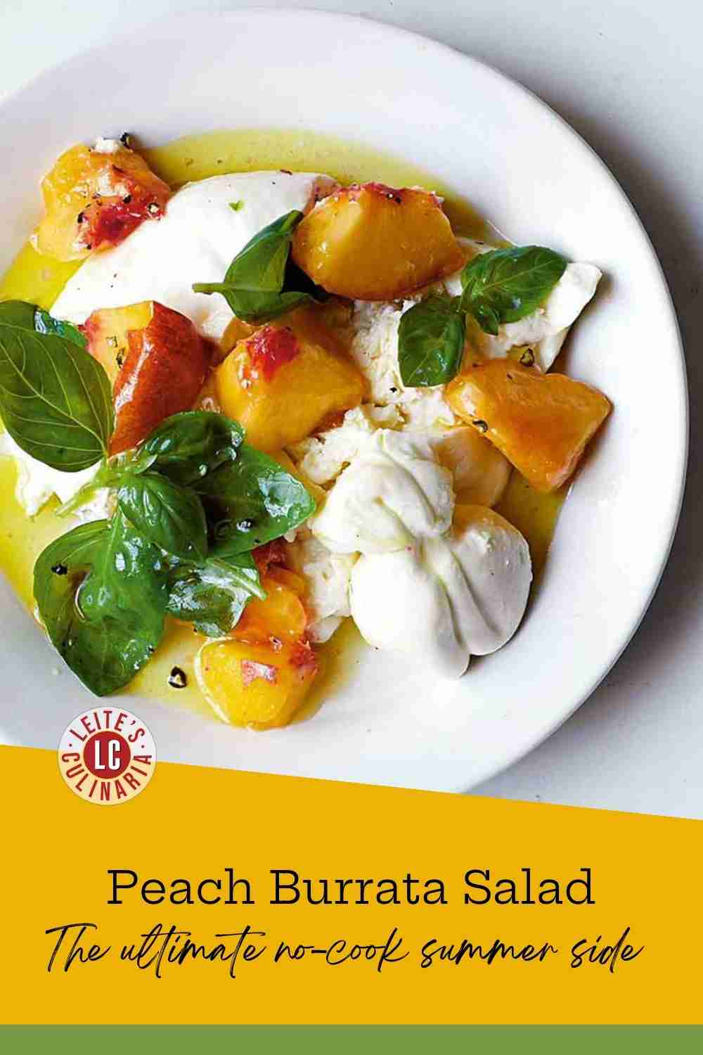 Creamy torn burrata cheese topped with sliced yellow peaches and fresh green basil in a white bowl.
