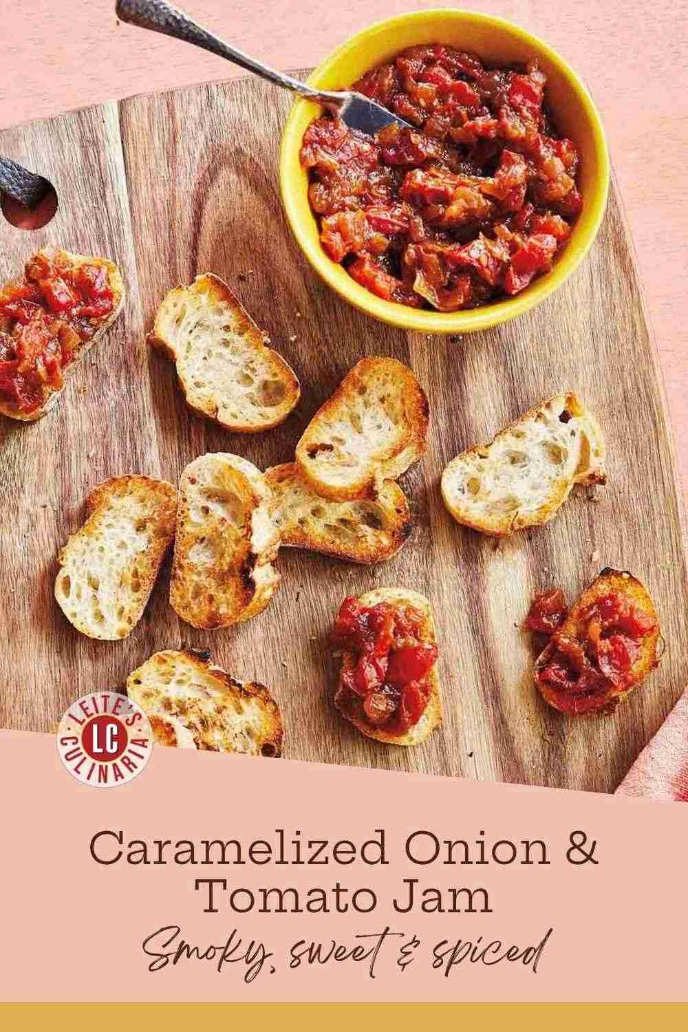 Dark caramelized onion and tomato jam spooned onto toasted baguette rounds on a wooden board.