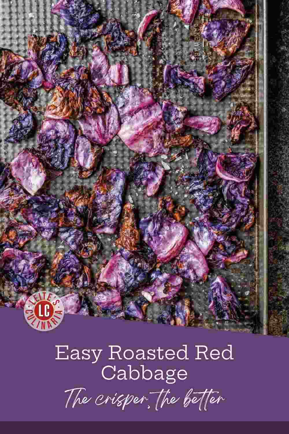 Purple red cabbage roasted on a dark sheet pan, edges browned and crisp.