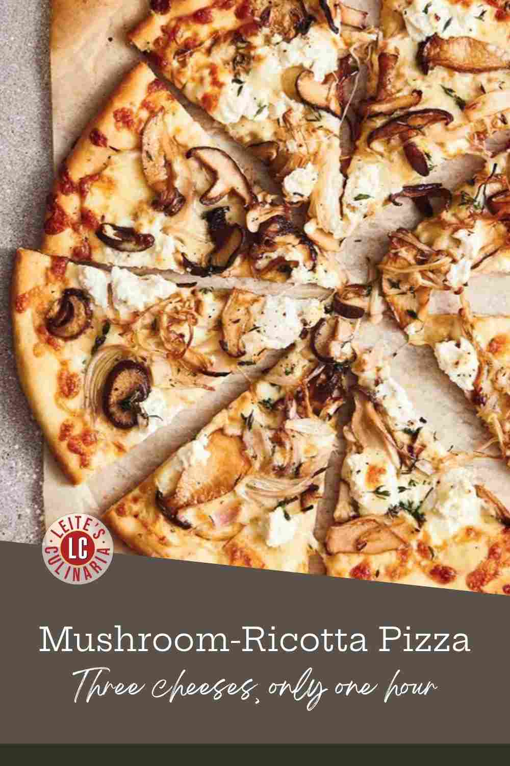 A whole white pizza cut into slices, topped with sauteed mushrooms and dollops of ricotta.