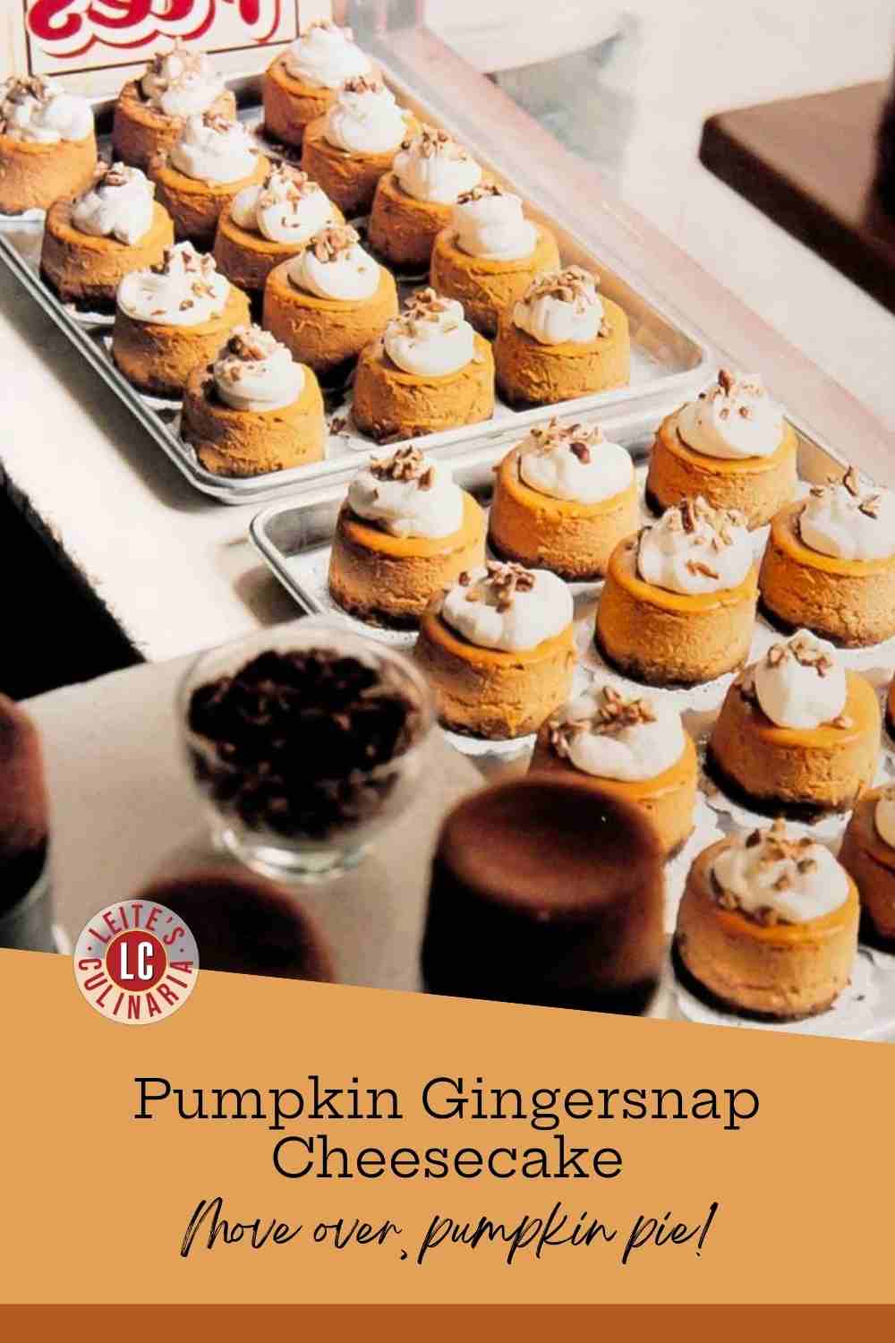Rows of mini pumpkin cheesecakes topped with whipped cream and chopped pecans on sheet pans.