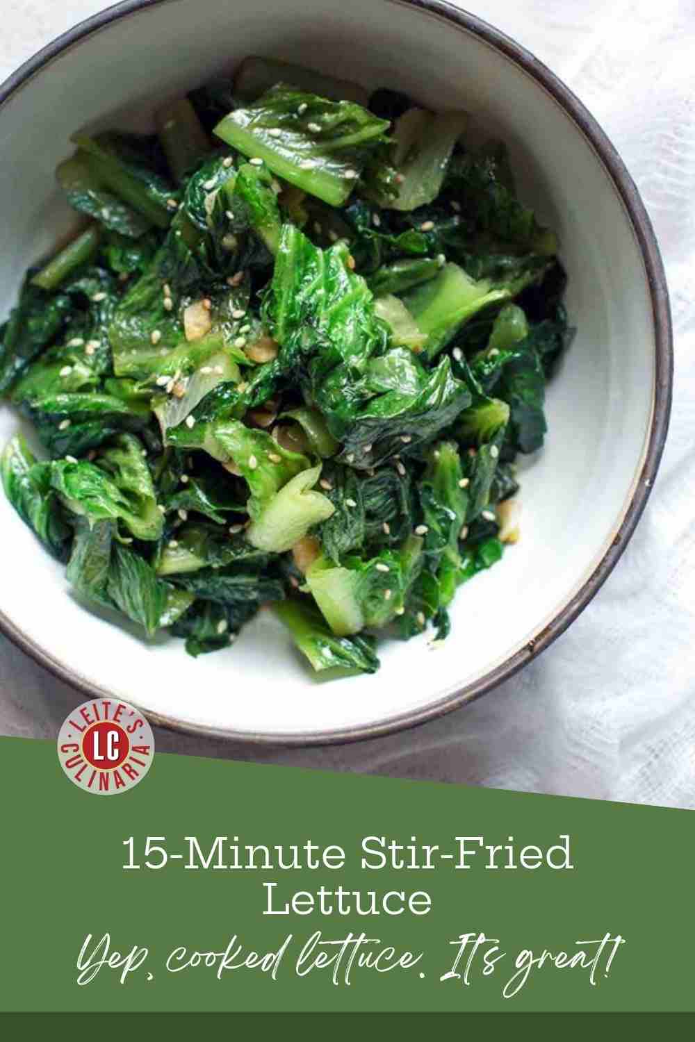 Bright green stir-fried lettuce flecked with sesame seeds and garlic in a white bowl with a dark rim.