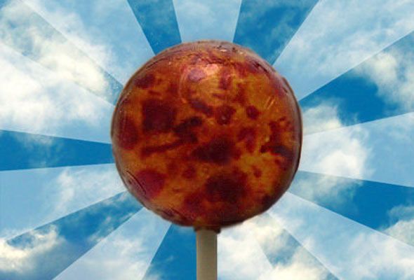 Lolly pop with blue striped background.