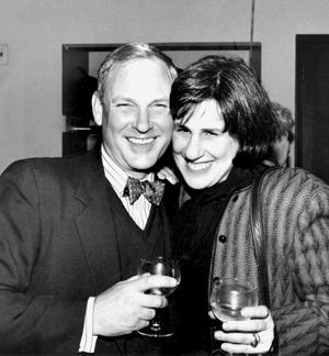 A black and white photo of Paula Wolfert James Villas both holding wine glasses.