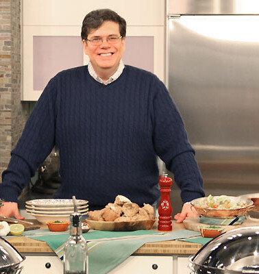 David in a blue sweater and glasses in the kitchen on the set of the Today Show.