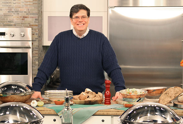 David in a blue sweater and glasses in the kitchen on the set of the Today Show.